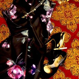 Beautiful black dress with floral. Great dress for office to drinks